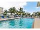 Inviting pool area with lounge chairs and palm trees at 7910 34Th W Ave # 102, Bradenton, FL 34209