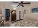 Guest bedroom with a queen bed, large closet, and ceiling fan at 8414 Imperial Cir, Palmetto, FL 34221