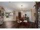 Dining room with view into kitchen and hardwood floors at 8414 Imperial Cir, Palmetto, FL 34221