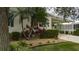 Landscaped yard with mature plants and gravel at 8414 Imperial Cir, Palmetto, FL 34221