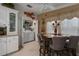 Kitchen nook with a built-in laundry area and a charming table for four at 8414 Imperial Cir, Palmetto, FL 34221