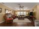 Living room with hardwood floors, fireplace, and comfy seating at 8414 Imperial Cir, Palmetto, FL 34221