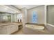 Bathroom features a soaking tub and walk-in shower at 8994 Wildlife Loop, Sarasota, FL 34238