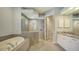 Large bathroom with a walk-in shower and double vanity at 8994 Wildlife Loop, Sarasota, FL 34238