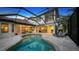 Expansive pool and patio area with covered seating at 8994 Wildlife Loop, Sarasota, FL 34238