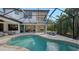 Inviting freeform pool with screened enclosure at 8994 Wildlife Loop, Sarasota, FL 34238