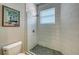 Modern shower with glass enclosure and patterned tile floor at 8994 Wildlife Loop, Sarasota, FL 34238