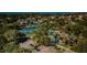 Aerial view of community, highlighting amenities at 1003 Lake Avoca Dr, Tarpon Springs, FL 34689