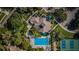 Community clubhouse with pool and tennis courts at 1003 Lake Avoca Dr, Tarpon Springs, FL 34689