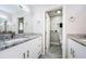 Bright bathroom with granite countertops and double sinks at 1003 Lake Avoca Dr, Tarpon Springs, FL 34689