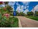 Pointe Alexis community entrance with lush landscaping at 1003 Lake Avoca Dr, Tarpon Springs, FL 34689