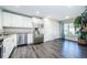 Modern kitchen with stainless steel appliances and white cabinets at 1003 Lake Avoca Dr, Tarpon Springs, FL 34689