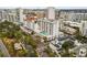 Aerial view of a high-rise building with a pool and surrounding city at 101 S Gulfstream Ave # 12C, Sarasota, FL 34236