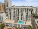 Aerial view of a modern building with a pool and city views at 101 S Gulfstream Ave # 12C, Sarasota, FL 34236