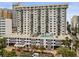 Aerial view of a high-rise building with a pool and city views at 101 S Gulfstream Ave # 12C, Sarasota, FL 34236