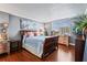 Bright bedroom with wood floors and a comfortable bed at 101 S Gulfstream Ave # 12C, Sarasota, FL 34236