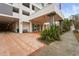 Condominium entrance with brick pavers and landscaping at 101 S Gulfstream Ave # 12C, Sarasota, FL 34236