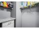 Laundry room with granite countertop and shelving at 101 S Gulfstream Ave # 12C, Sarasota, FL 34236