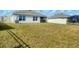 Large backyard with grassy area and view of neighboring homes at 10328 Charlotte Dr, Parrish, FL 34219