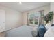 Well-lit bedroom with large window and plush bedding at 10328 Charlotte Dr, Parrish, FL 34219