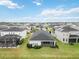 Aerial view of houses and community with lake at 10531 Piedra Dr, Palmetto, FL 34221