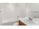 Clean bathroom with white tile and a bathtub at 10531 Piedra Dr, Palmetto, FL 34221