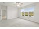 Bedroom with large windows and a water view at 10531 Piedra Dr, Palmetto, FL 34221