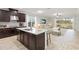 Modern kitchen with large island and open concept design at 10531 Piedra Dr, Palmetto, FL 34221