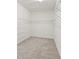 Large walk-in closet with wire shelving and carpeting at 10531 Piedra Dr, Palmetto, FL 34221