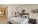 Bright bedroom with plush bedding and city views at 111 S Pineapple Ave # 1006, Sarasota, FL 34236