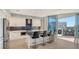 Modern kitchen with white cabinets, blue tile backsplash at 111 S Pineapple Ave # 1006, Sarasota, FL 34236