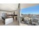 Modern kitchen opens to a private balcony with city views at 111 S Pineapple Ave # 1006, Sarasota, FL 34236