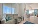 Relaxing living area with modern couch and city views at 111 S Pineapple Ave # 1006, Sarasota, FL 34236