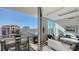 Living area with access to a balcony offering city views at 111 S Pineapple Ave # 1006, Sarasota, FL 34236