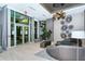 Modern building entrance with glass doors and stylish lounge at 111 S Pineapple Ave # 1006, Sarasota, FL 34236