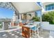 Outdoor kitchen with grill, sink and bar seating at 111 S Pineapple Ave # 1006, Sarasota, FL 34236