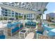 Relaxing pool deck with patio furniture and city views at 111 S Pineapple Ave # 1006, Sarasota, FL 34236