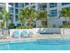 Resort-style pool with lounge chairs and a hot tub at 111 S Pineapple Ave # 1006, Sarasota, FL 34236