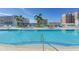 Inviting rooftop pool with lounge chairs and city views at 111 S Pineapple Ave # 1006, Sarasota, FL 34236