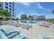 Relaxing rooftop pool with ample lounge chairs and city views at 111 S Pineapple Ave # 1006, Sarasota, FL 34236