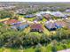 Aerial view of house and neighborhood with lake at 12654 Harney St, Venice, FL 34293