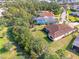 Aerial view of a single-Gathering home with a large backyard and a tile roof at 12654 Harney St, Venice, FL 34293