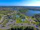 Aerial view of community with lake and amenities at 12654 Harney St, Venice, FL 34293