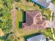 Directly above view of home showing a unique roofline and lush landscaping at 12654 Harney St, Venice, FL 34293