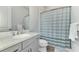 Small bathroom with shower and single vanity at 12654 Harney St, Venice, FL 34293