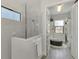 Bathroom with glass shower and linen closet at 12654 Harney St, Venice, FL 34293