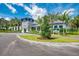 The Social Club: inviting community center with landscaping and palm trees at 12654 Harney St, Venice, FL 34293