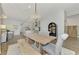 Spacious dining room with a farmhouse table and bench seating at 12654 Harney St, Venice, FL 34293