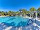 Large community pool with plenty of seating at 12654 Harney St, Venice, FL 34293