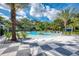 Freeform community pool with a surrounding patio at 12654 Harney St, Venice, FL 34293